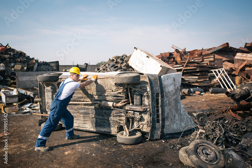 Worker in a junkyard