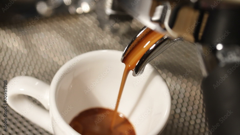 espresso being poured from a proffesional espresso machine