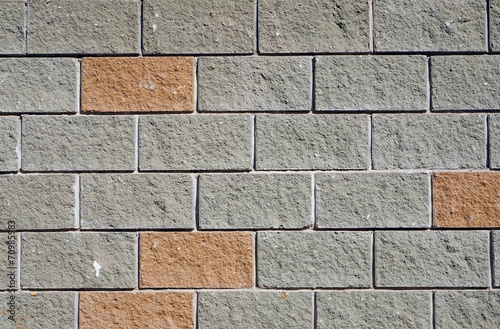 The wall of the large gray and red rectangular stones as backgro