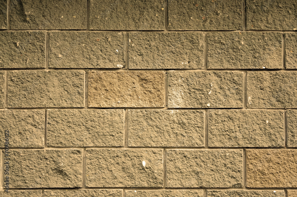 Fototapeta premium The wall of the large rectangular stones as background tinted se