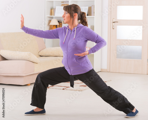 Woman doing qi gong tai chi exercise