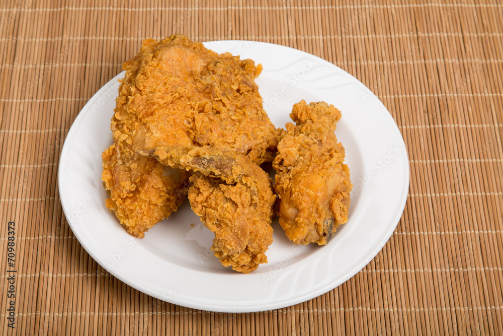Fried Chicken on Small Plate and Bamboo Placemat Fried Chicken on Small Plate and Bamboo Placemat