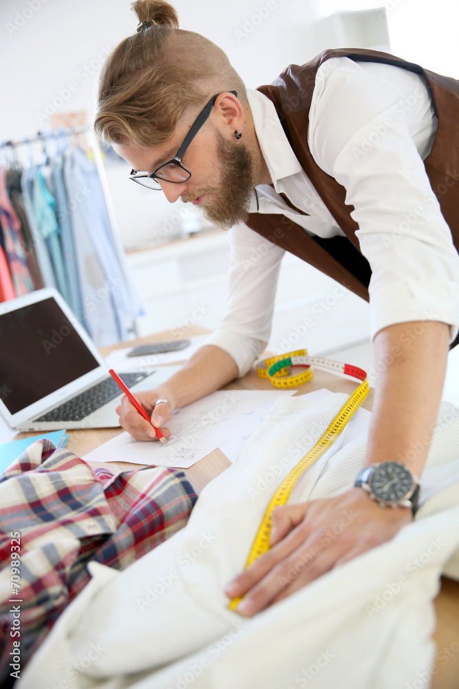 Fashion designer in workshop Fashion designer in workshop