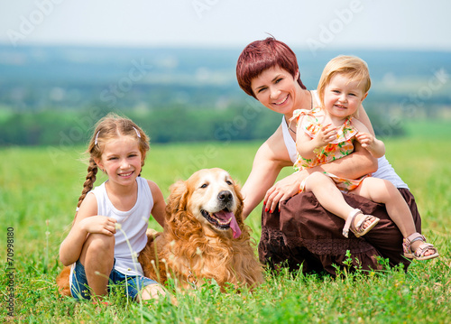 Family with a golden retriever dog