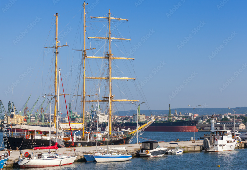 Big sailing ship and pleasure boats in port of Varna, Bulgaria