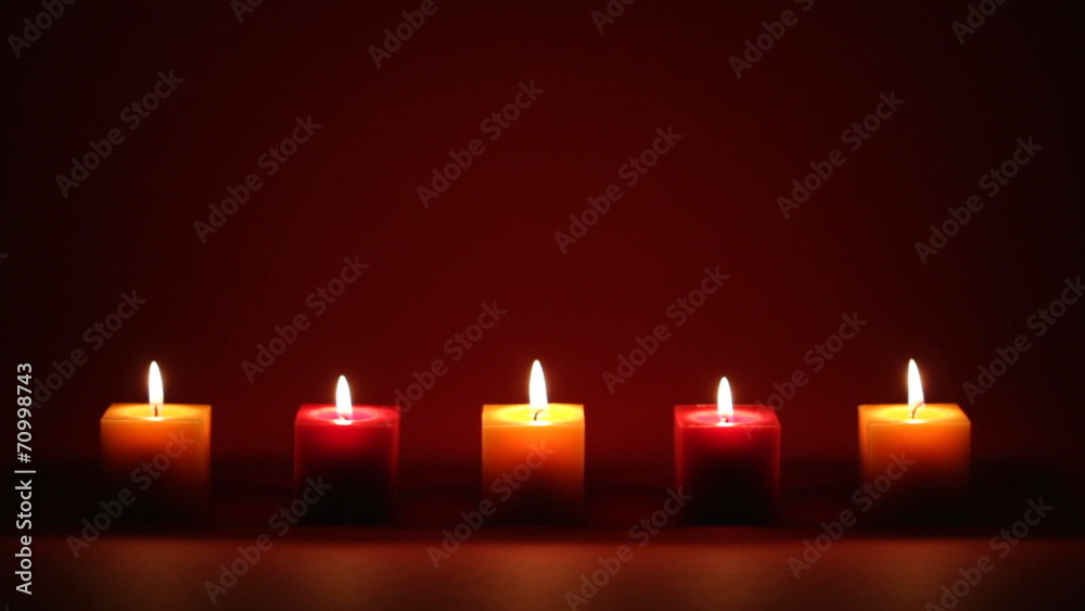 candles in a row on dark background candles in a row on dark background