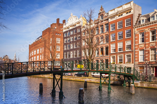 Canvas Print Colorful living houses on the canal coast in Amsterdam, Netherla