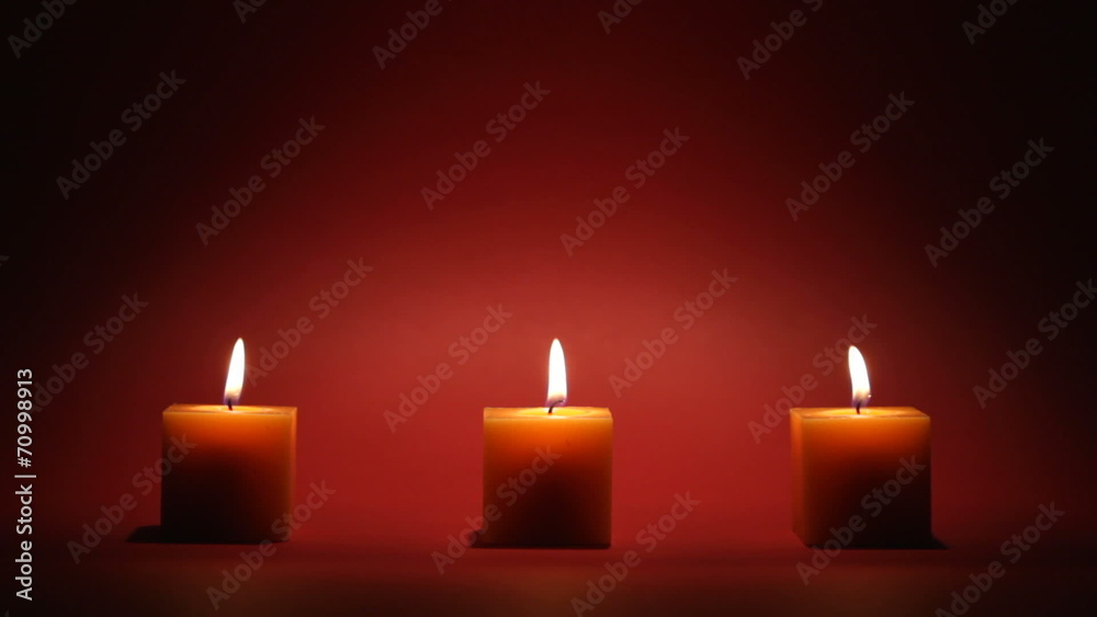 candles in a row on dark background candles in a row on dark background