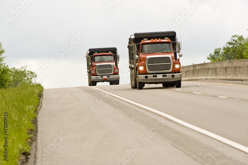 Two Dump Trucks on Highway