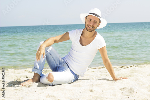 Smile male model enjoying summer travel holiday by the ocean.