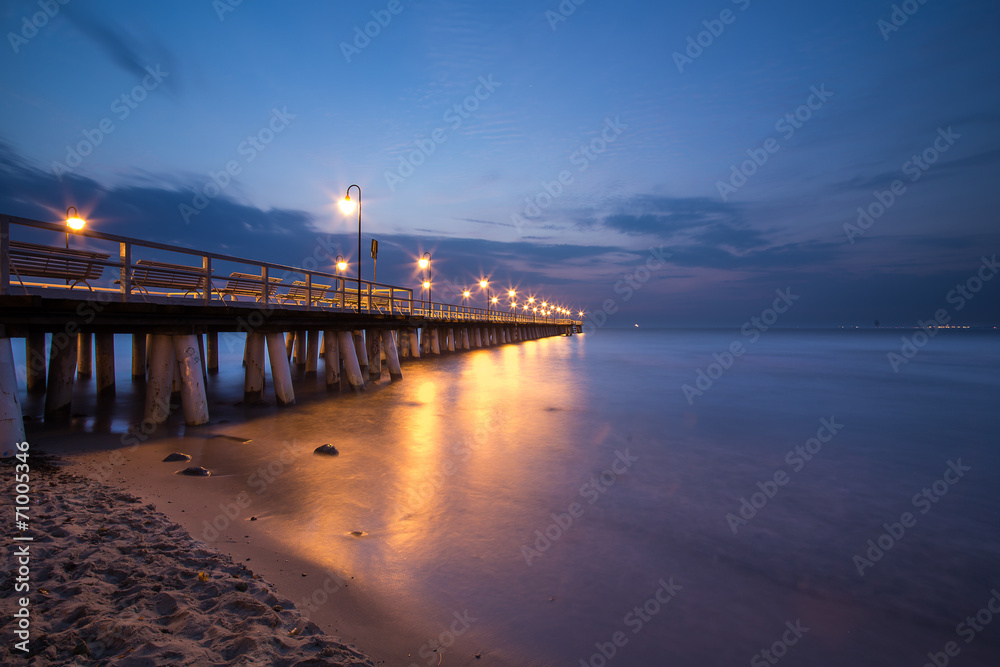 Sunrise on the pier at the seaside, Gdynia Orlowo, Poland