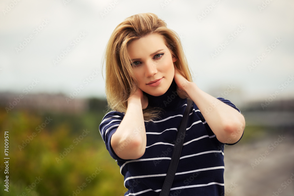 Portrait of happy young fashion woman outdoor