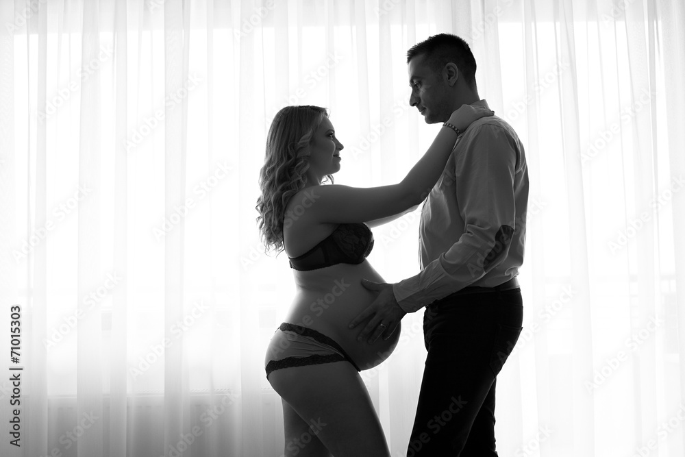 Black and white pregnant woman and her husband