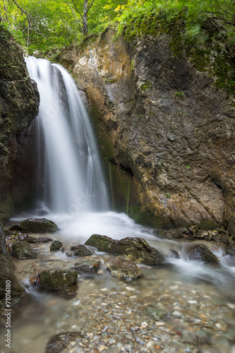 Deep forest waterfalls in the Transylvanian Alps