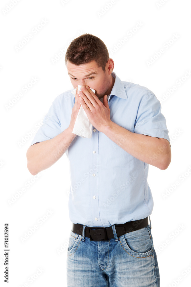 Sick man blowing her nose Sick man blowing her nose