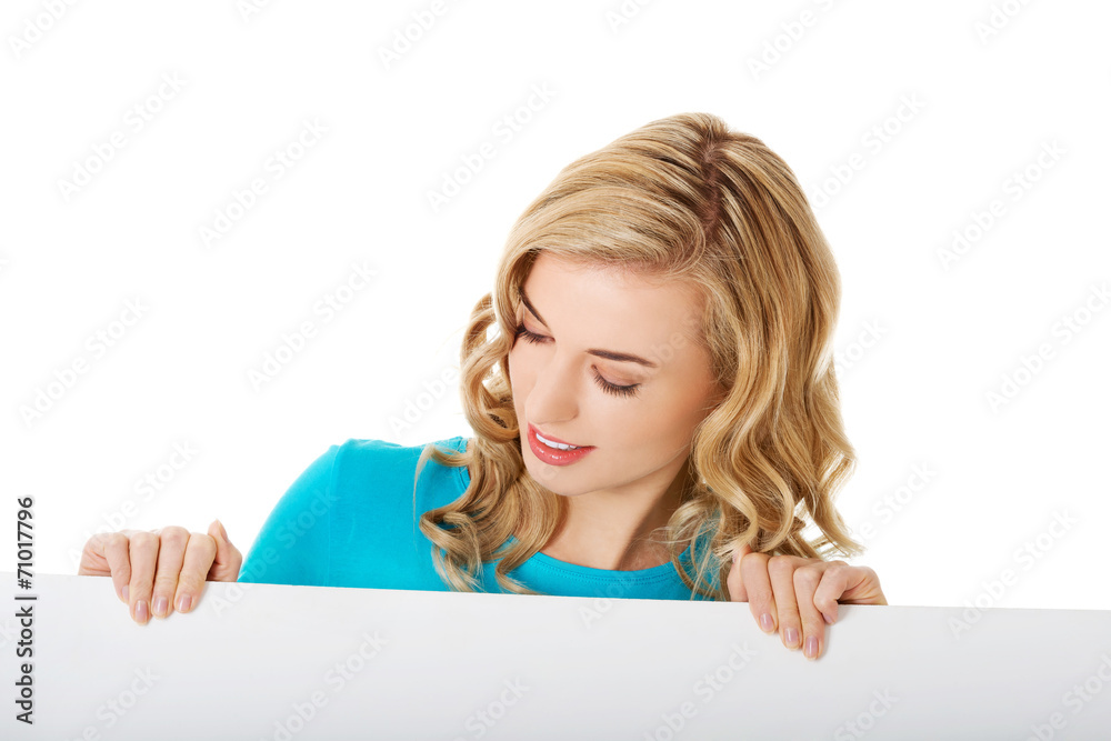 Portrait of happy woman with blank board Portrait of happy woman with blank board