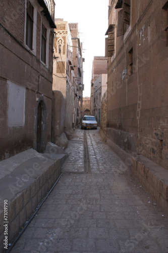 Narrow alley with car in Sanaa  Yemen