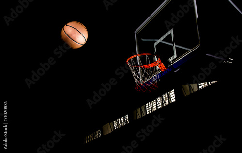 Basketball on  black background with light effect