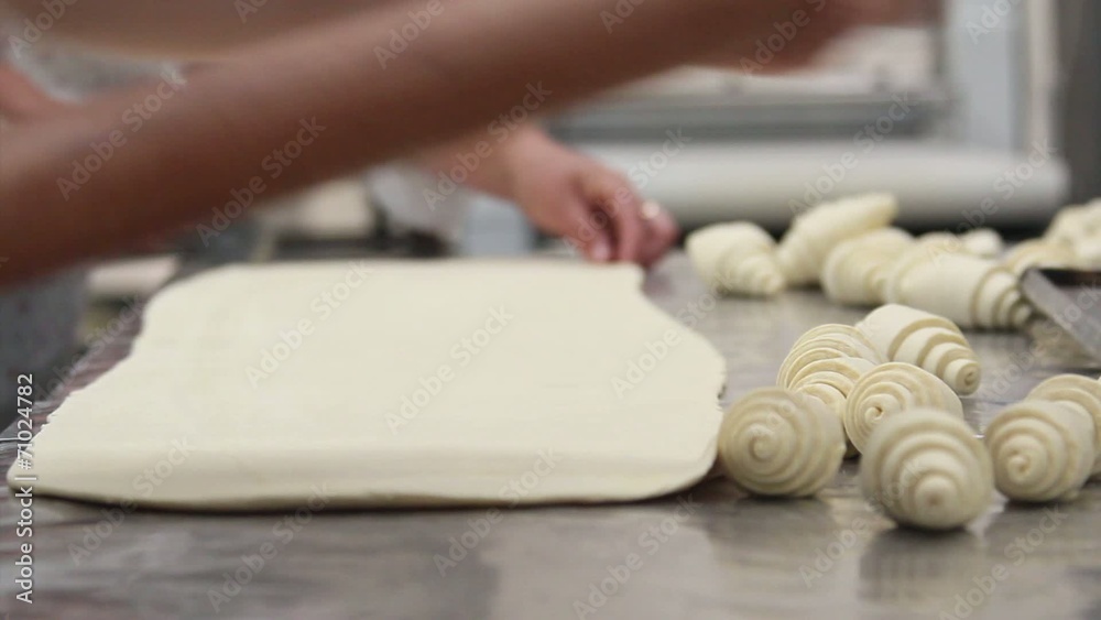 Commercial bakery.Baker roll french bread croissant. Commercial bakery.Baker roll french bread croissant.
