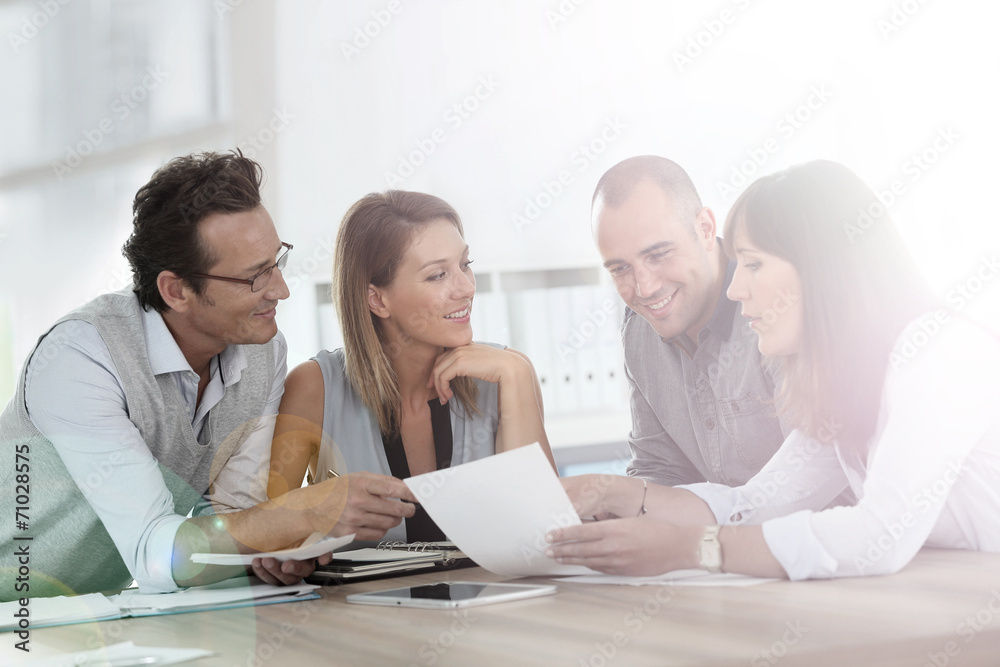 Group of business people meeting in office Group of business people meeting in office