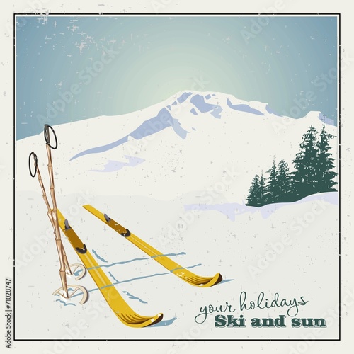 Winter  background. Mountains and ski equipment in the snow