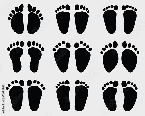 Black prints of baby feet, vector illustration