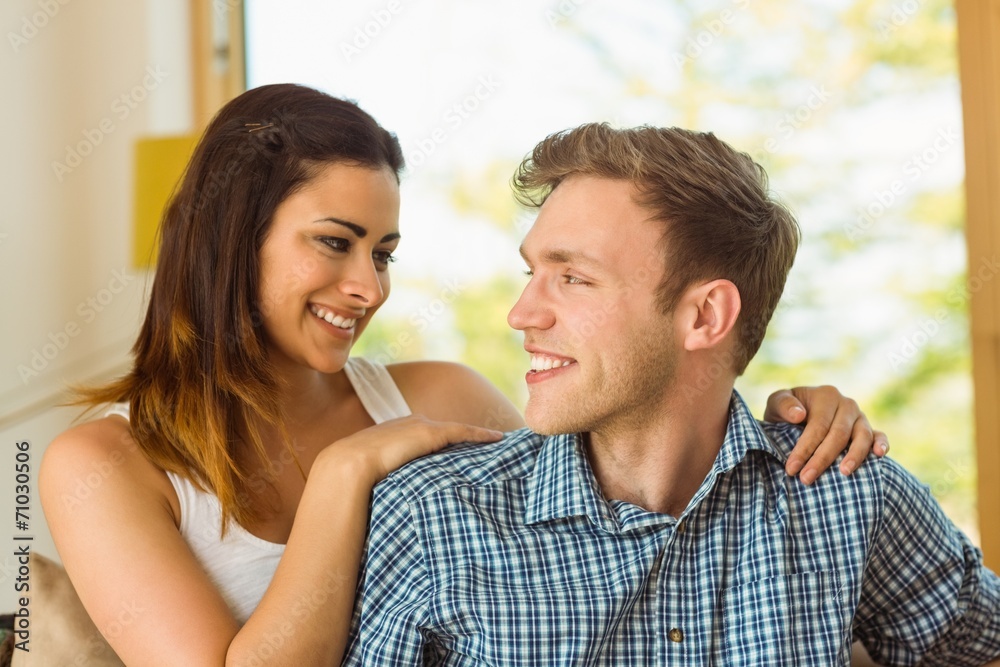 Happy young couple relaxing on the couch Happy young couple relaxing on the couch
