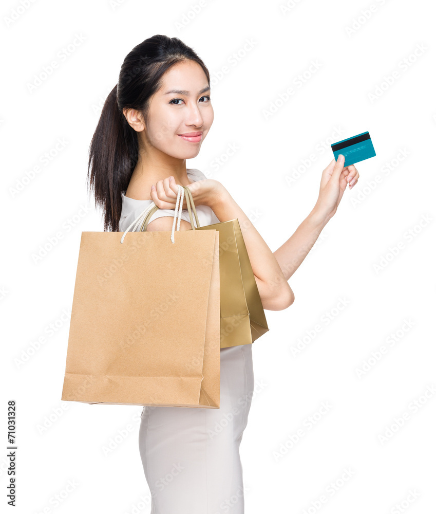 Happy shopping woman with paper bag and credit card Happy shopping woman with paper bag and credit card