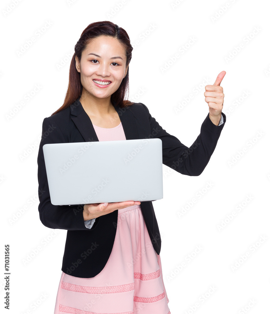Businesswoman use of laptop computer and thumb up Businesswoman use of laptop computer and thumb up