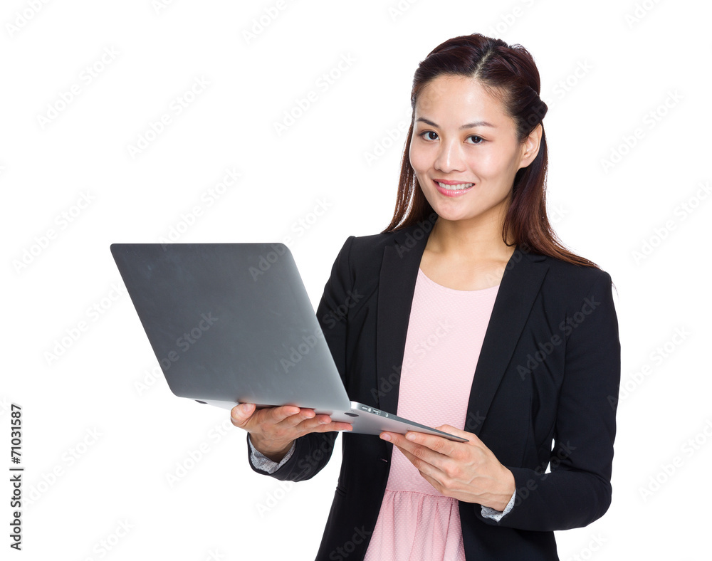 Asian businesswoman use of notebook computer Asian businesswoman use of notebook computer