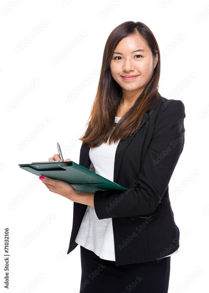 Businesswoman write on clipboard Businesswoman write on clipboard