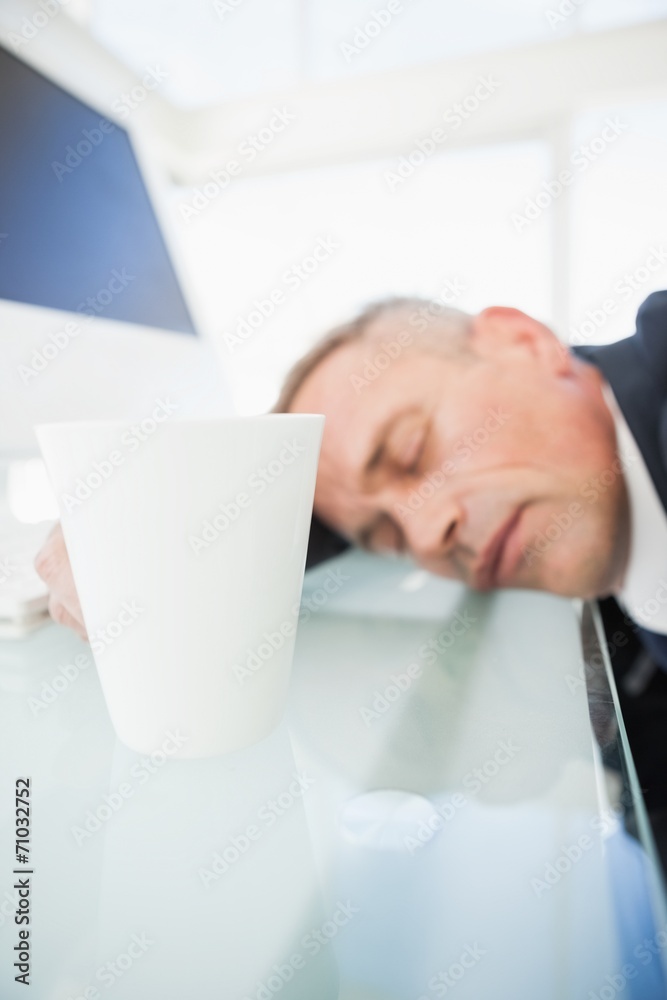 Exhausted businessman asleep at work Exhausted businessman asleep at work