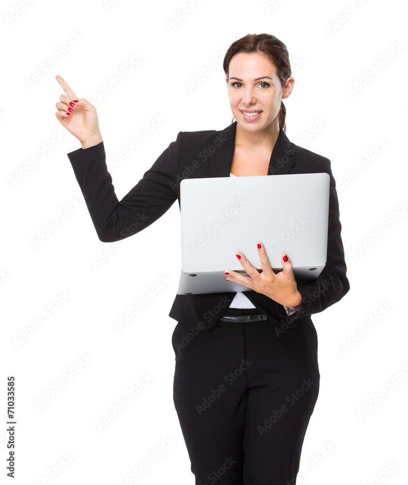 Businesswoman use of notebook computer and finger point up Businesswoman use of notebook computer and finger point up