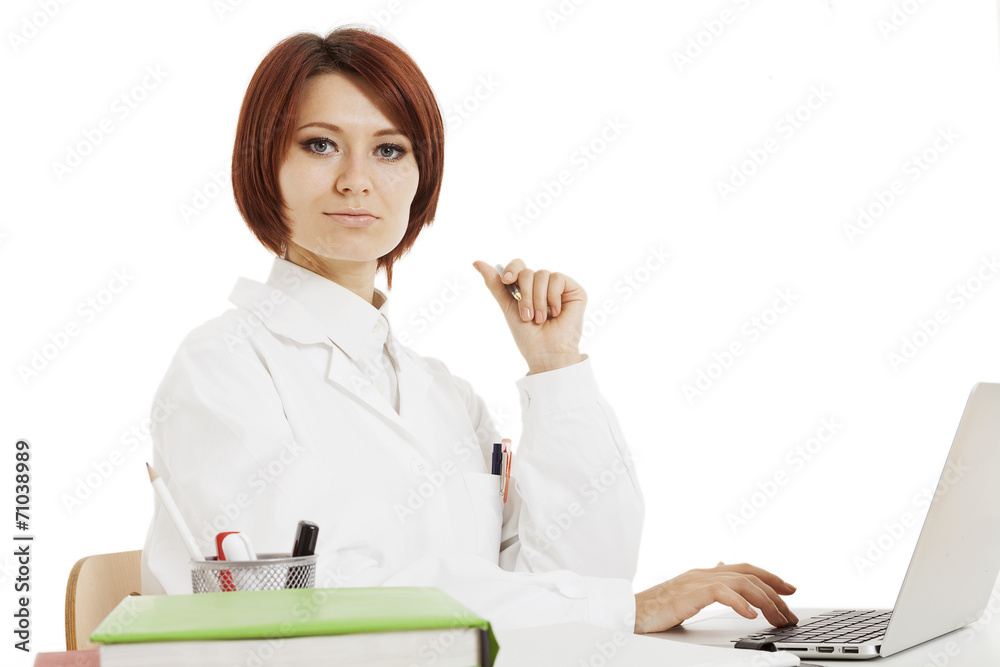 Doctor sitting behind her desk Doctor sitting behind her desk