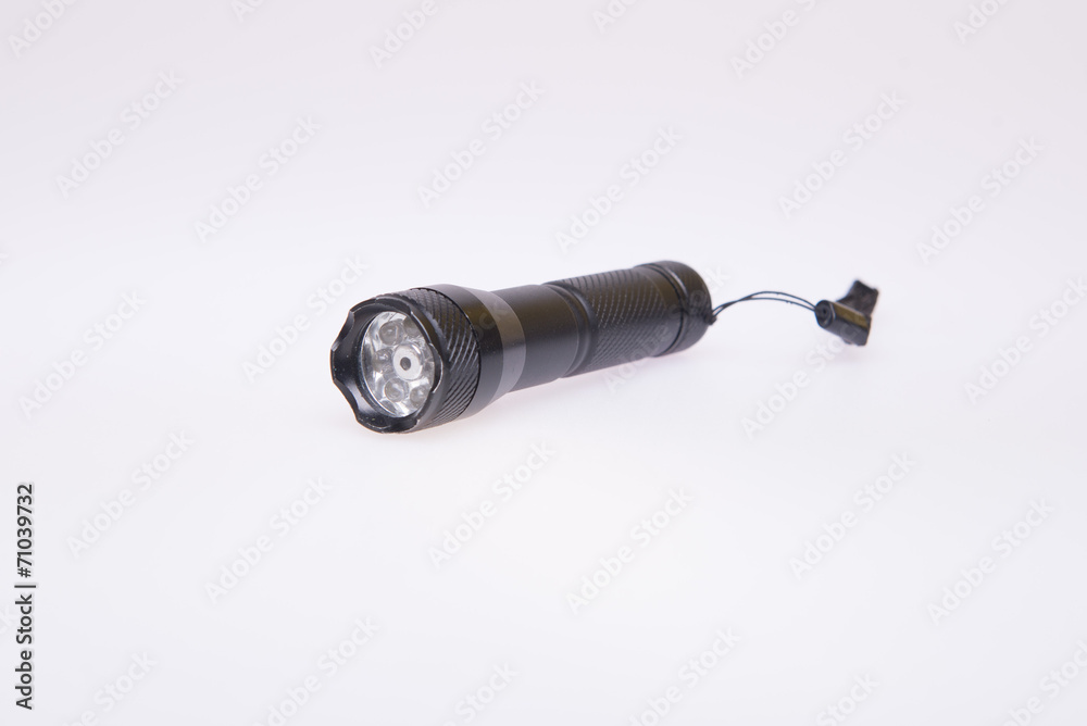 Black flashlight on white background Black flashlight on white background