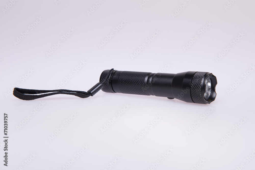 Black flashlight on white background Black flashlight on white background