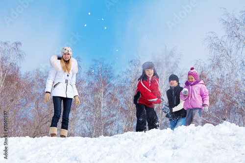 Family playing snowball