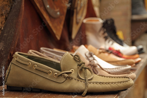 moccasins style shoes on shelf by italian shoe maker photo