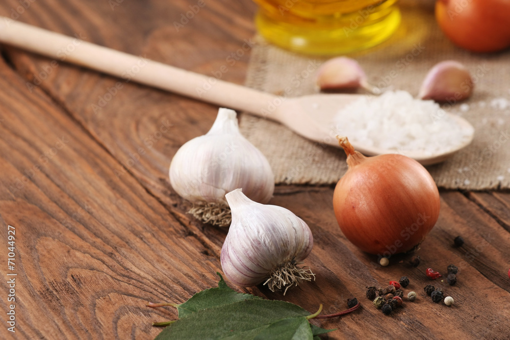 garlic, sea salt, pepper, sunflower oil, onions on a background garlic, sea salt, pepper, sunflower oil, onions on a background