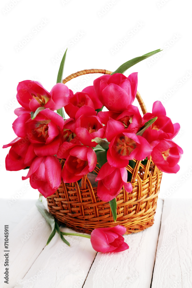pink tulips in a wicker basket