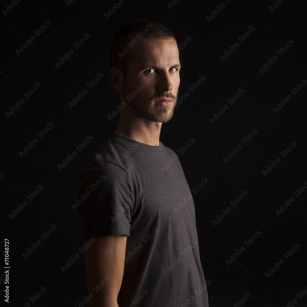 Fototapeta premium portrait of a handsome young man on black background