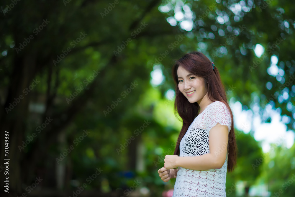 Portrait of young beautiful woman sitting on grass Portrait of young beautiful woman sitting on grass