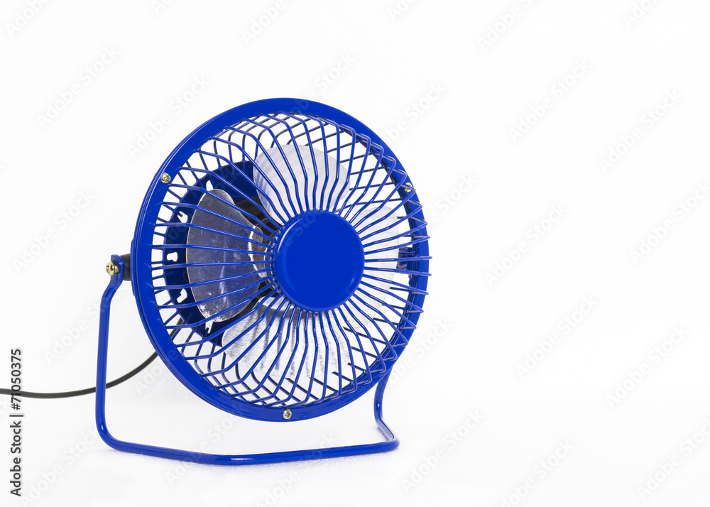 Isolated portable blue mini table fan on white