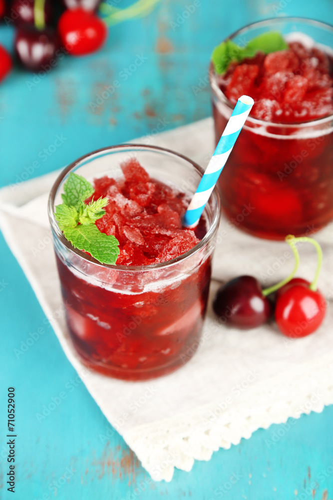 Closeup of cherry granita in glasses, on color wooden Closeup of cherry granita in glasses, on color wooden