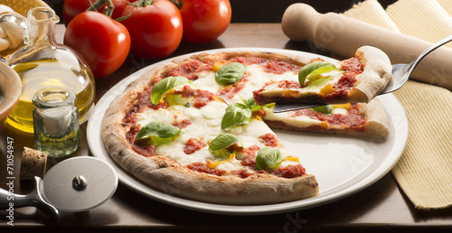 Pizza on the table with ingredients