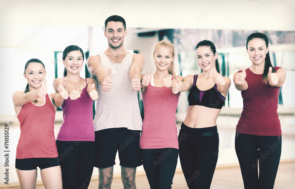 Fototapeta premium group of people in the gym showing thumbs up