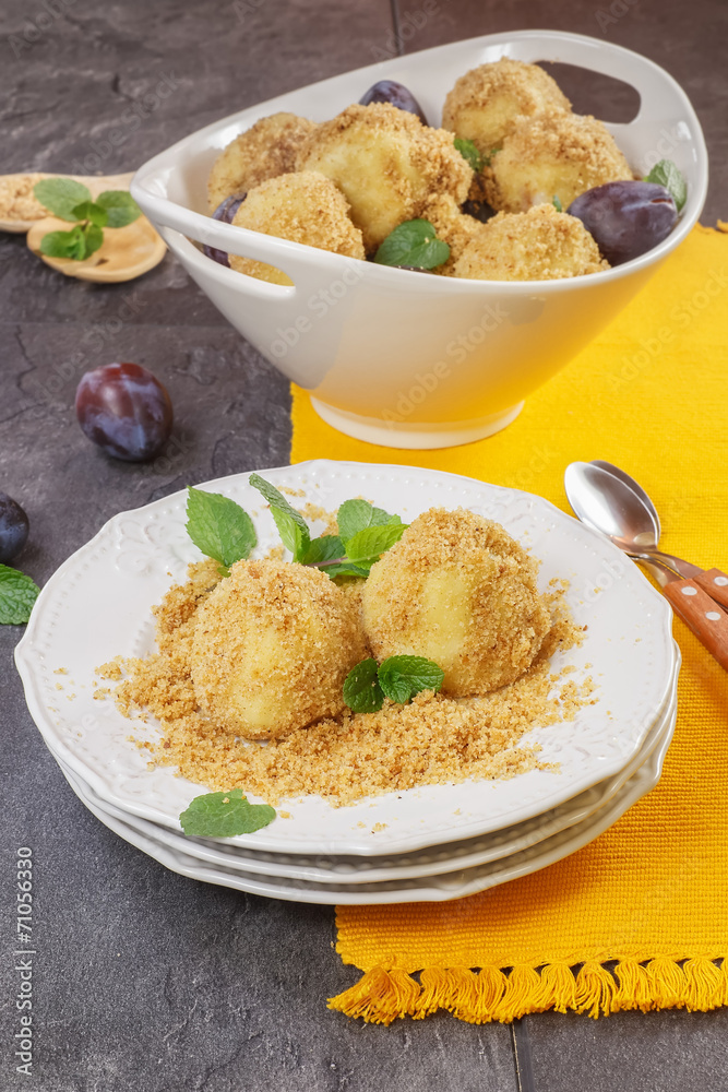 Plum dumplings covered with breadcrumb and sprinkled with sugar Plum dumplings covered with breadcrumb and sprinkled with sugar