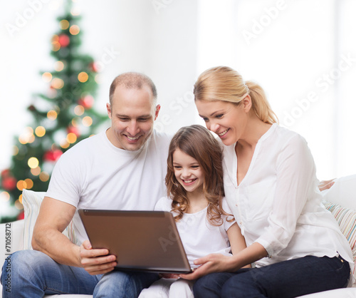 happy family with laptop computer