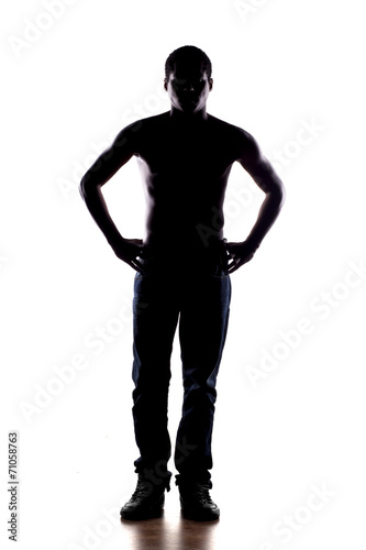 silhouette of a half-naked African man on a white background © vladimirfloyd