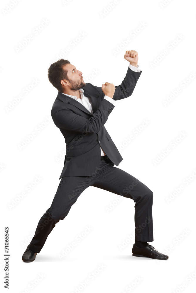 young businessman beating his fist